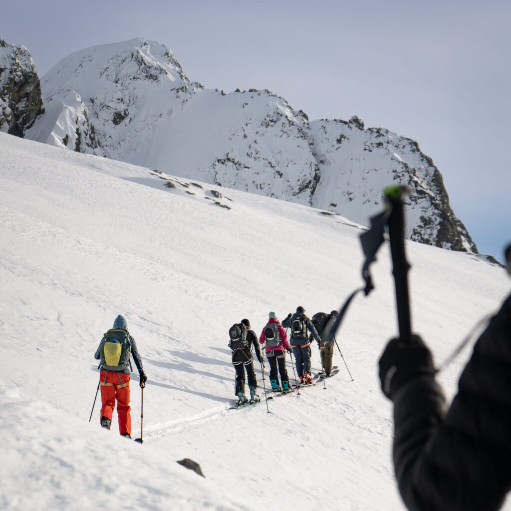 Women's group ski touring with heli access in the Tantalus Range near Squamish, BC