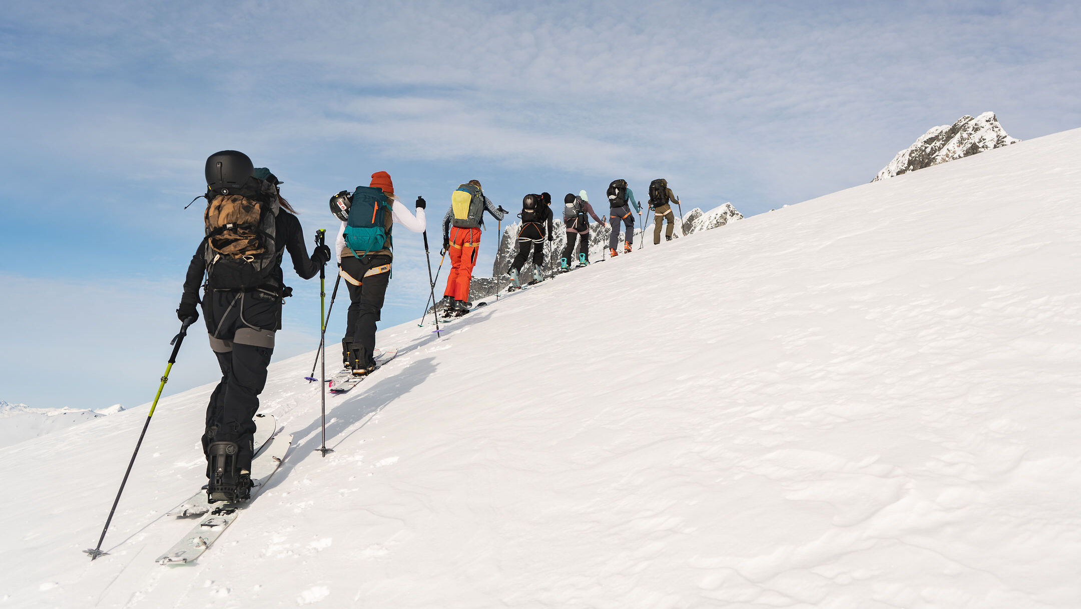 a group of women skinning up the mountain on an all women backcountry retreat on tantalus named lux snow and lead by alenka mali